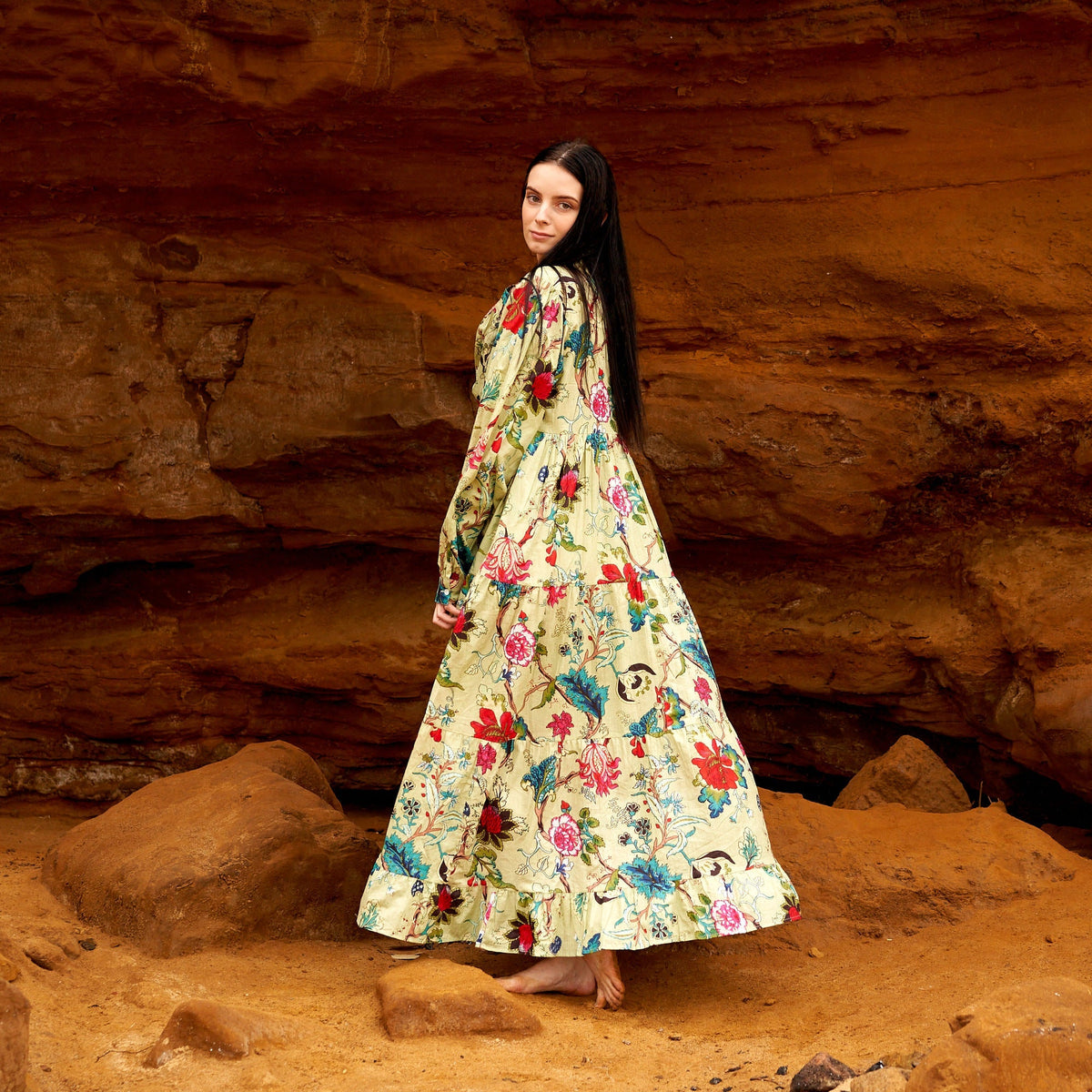 Woman wearing a long sleeve hand screen-printed cotton maxi dress